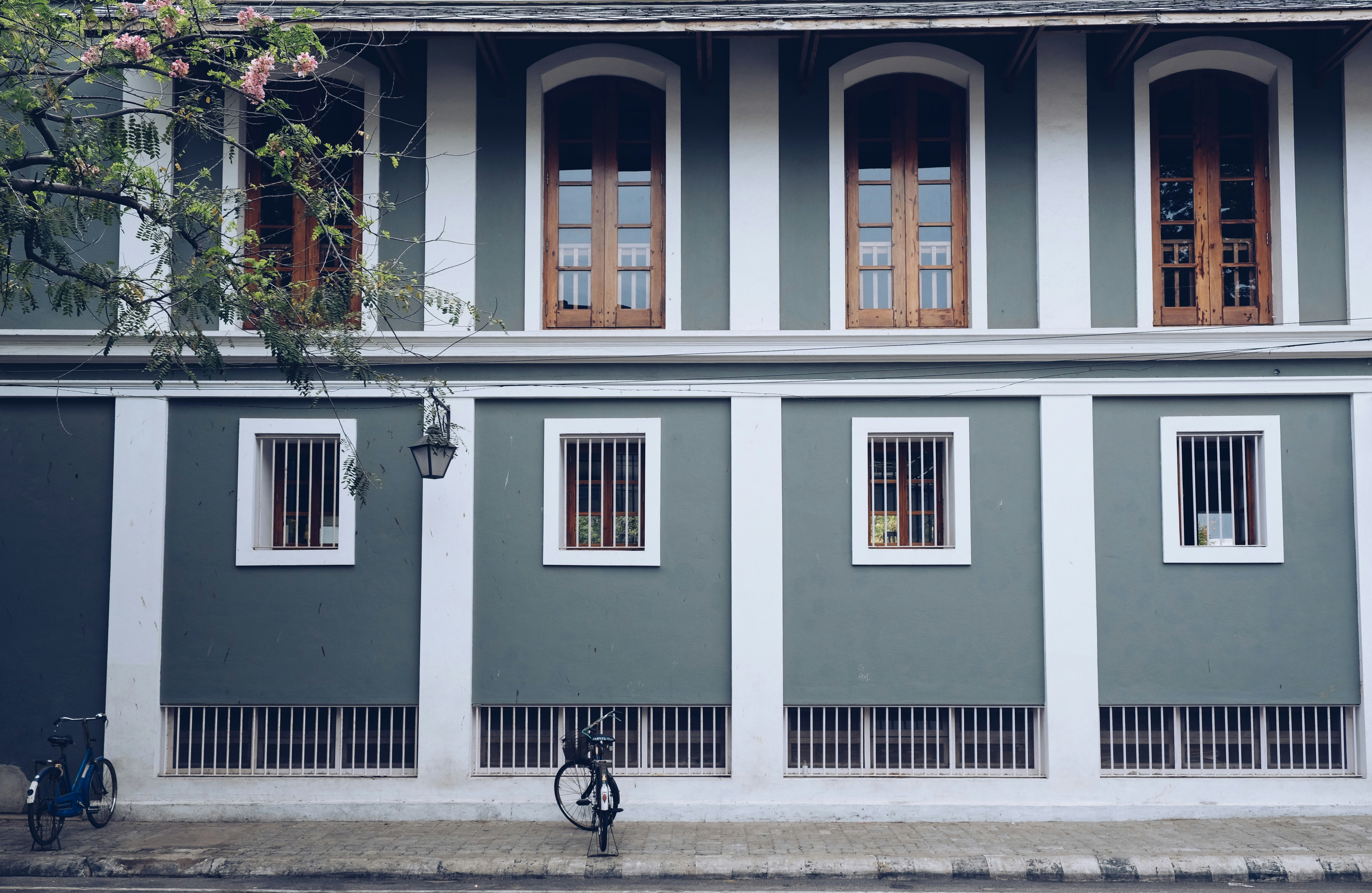 bike parked in front of gray house